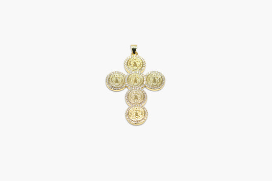 Gold cross pendant on a white background