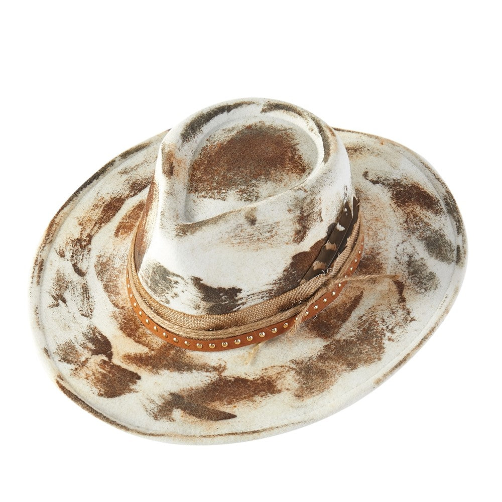 Cowboy hat with a patterned band on a white background