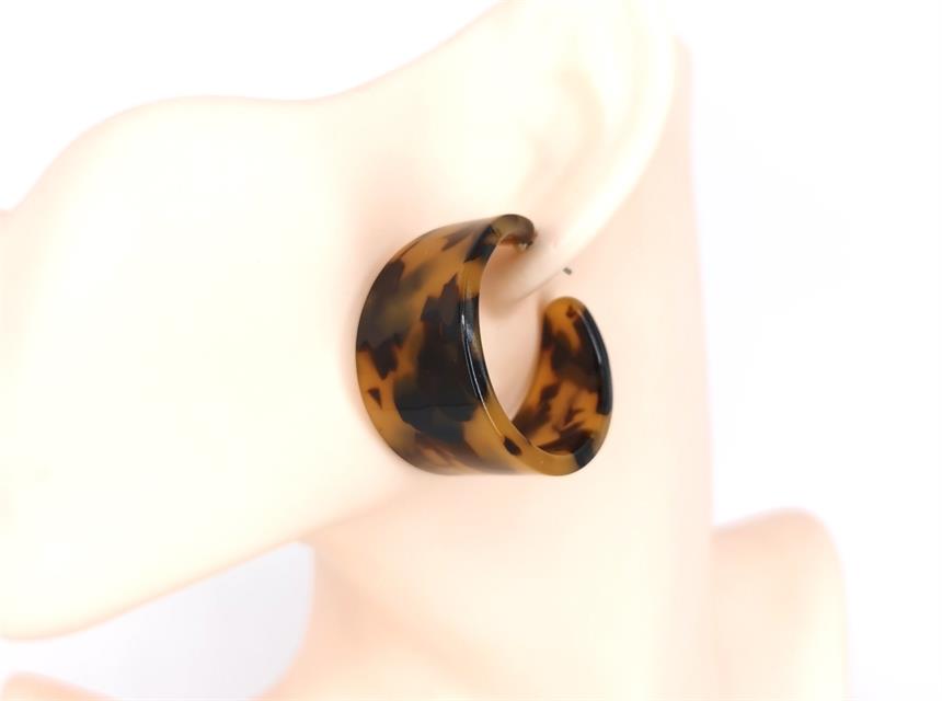 Tortoiseshell hoop earring on a white background