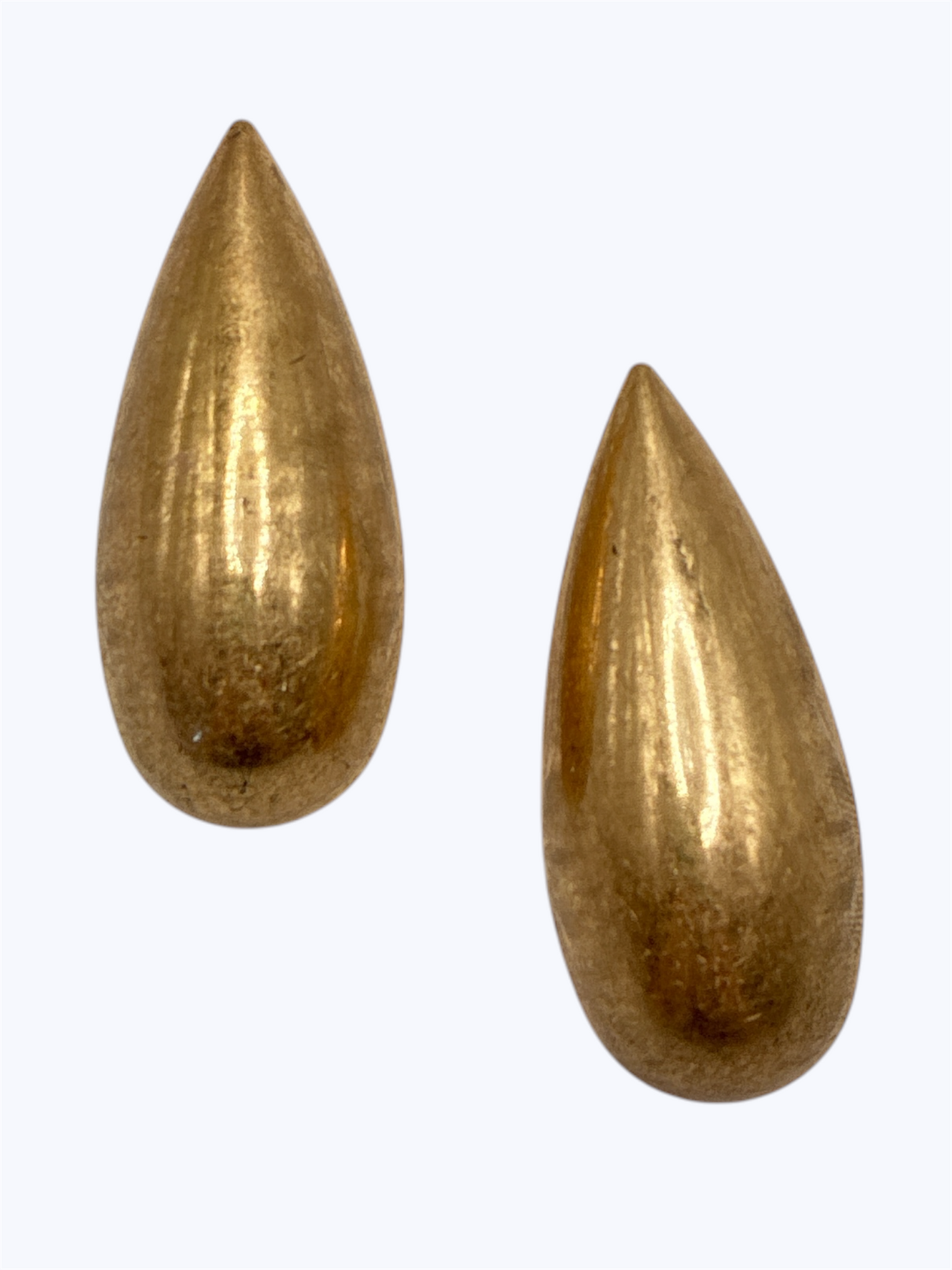 Brushed gold teardrop stud earrings with a sleek minimalist statement design