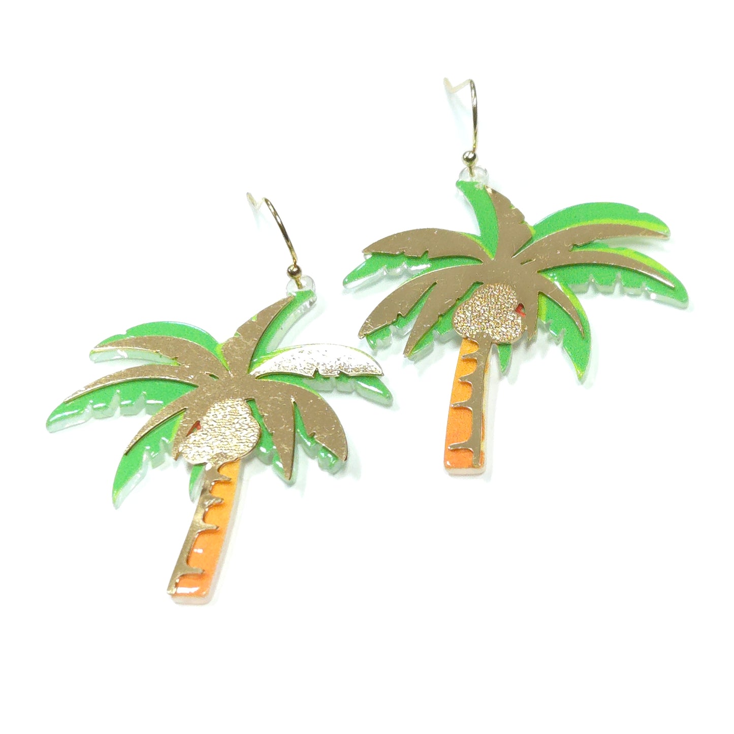 Palm tree earrings with green leaves and gold trunks on a white background