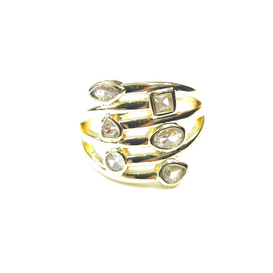 Gold ring with embedded crystals on a white background