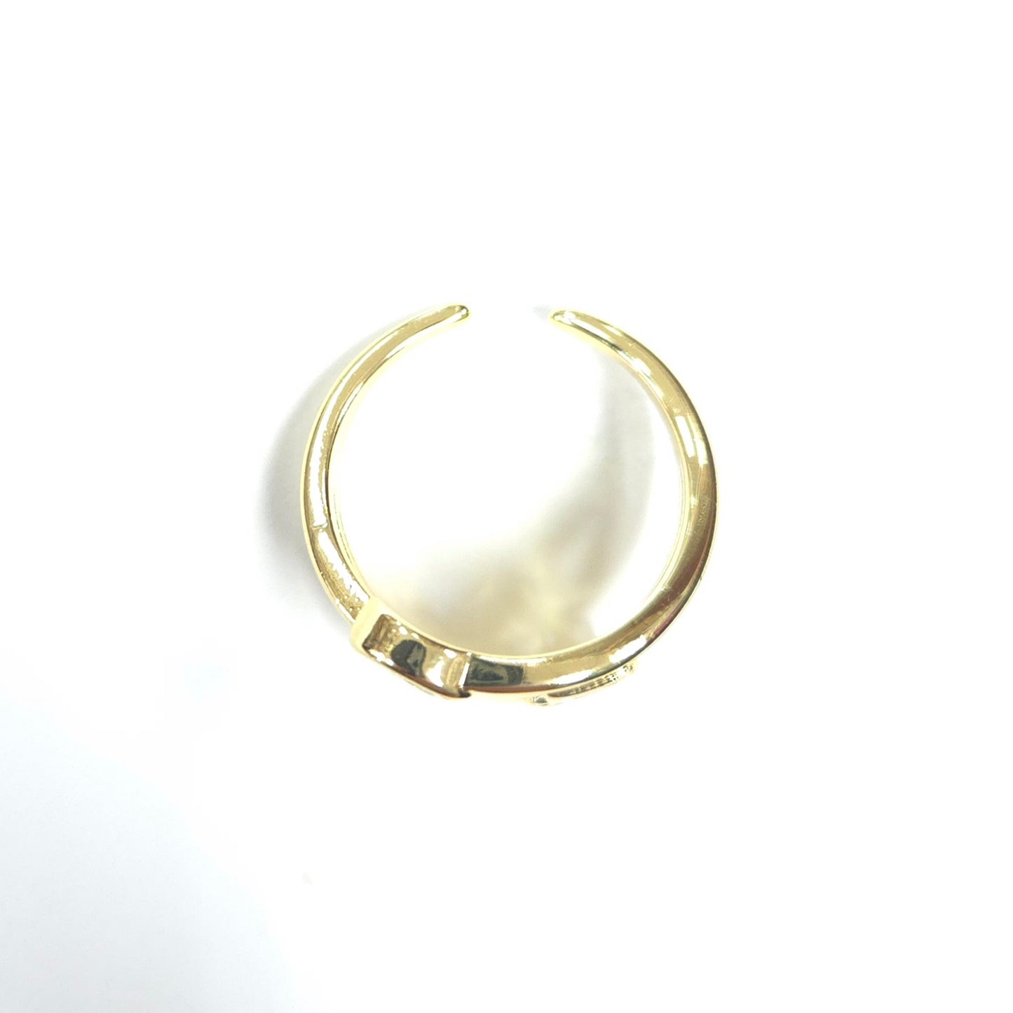 Gold hoop earring on a white background