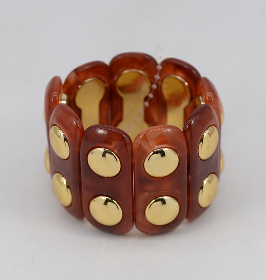 Brown stretch bracelet with gold circular accents on a white background