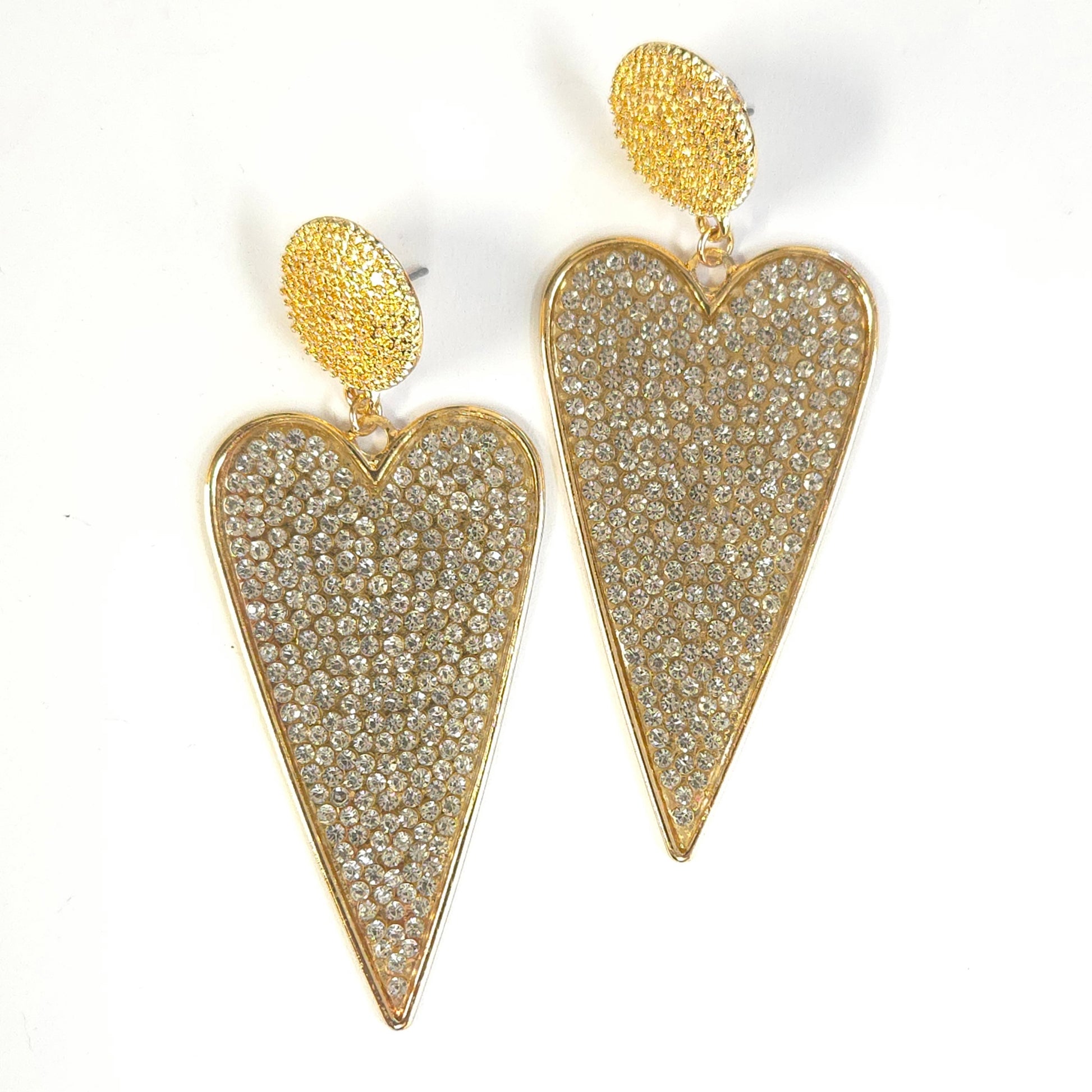 Heart-shaped earrings with gold and crystal detailing on a white background