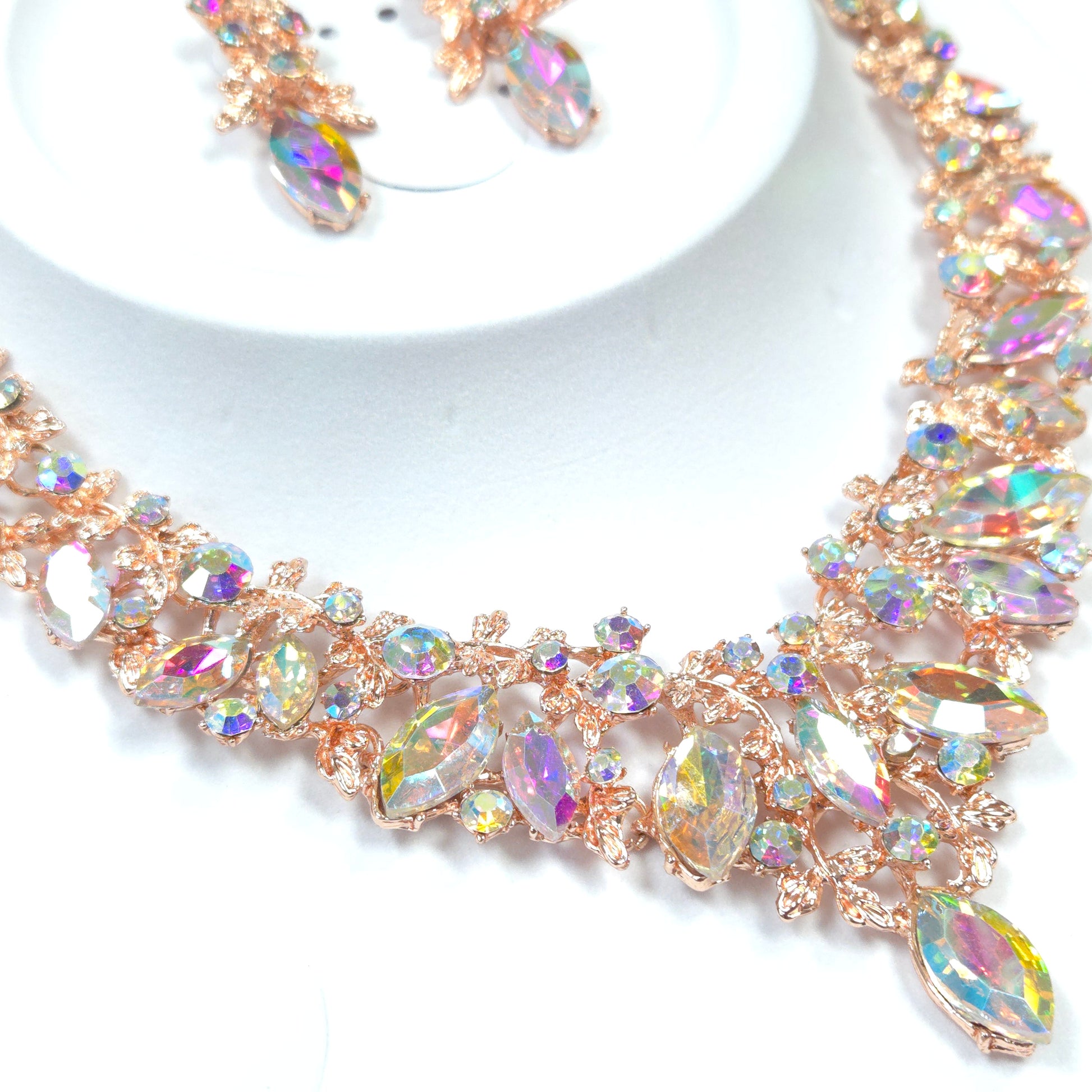 Rose gold headband with colorful crystals on a white background