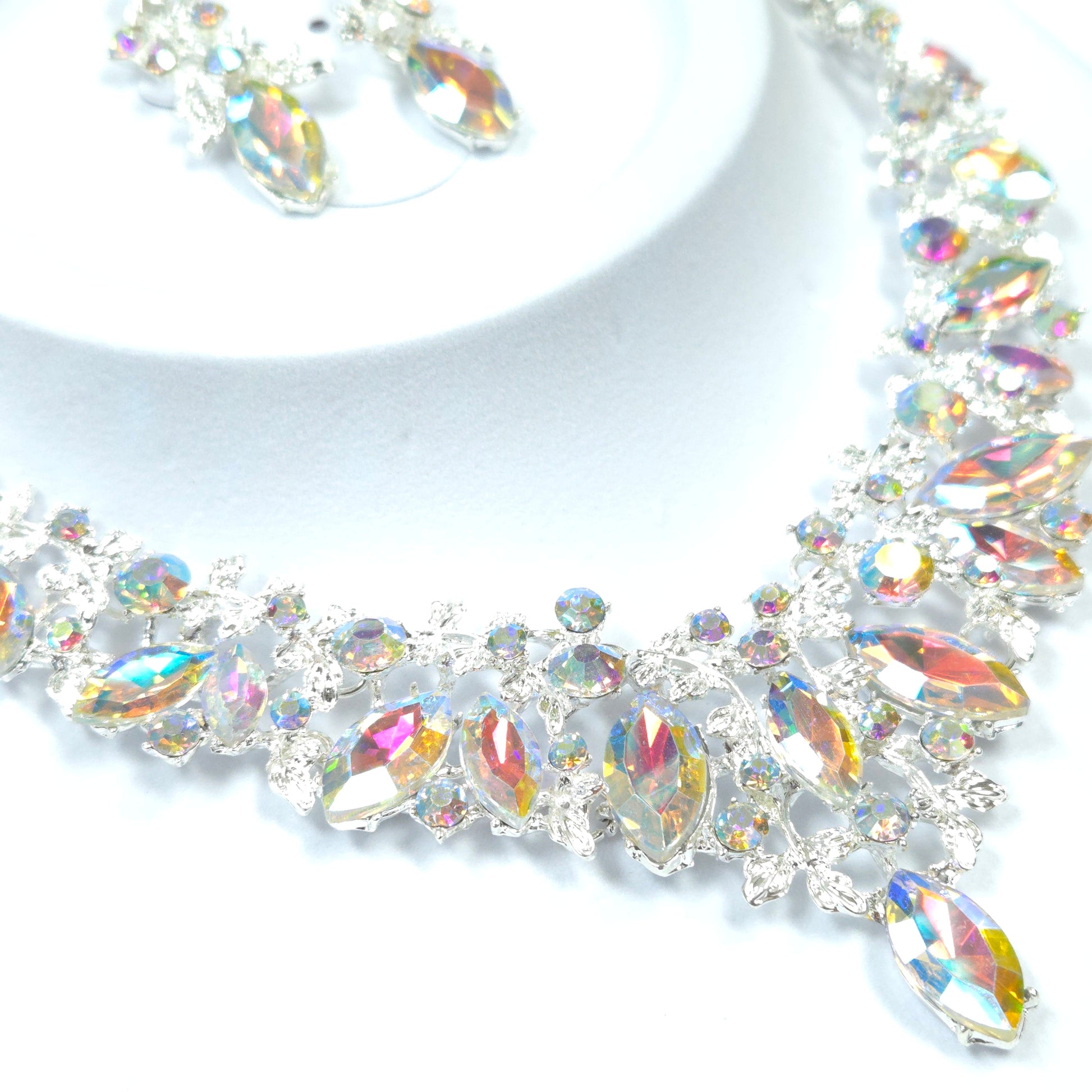 Decorative gemstone border with multicolored crystals on a white background