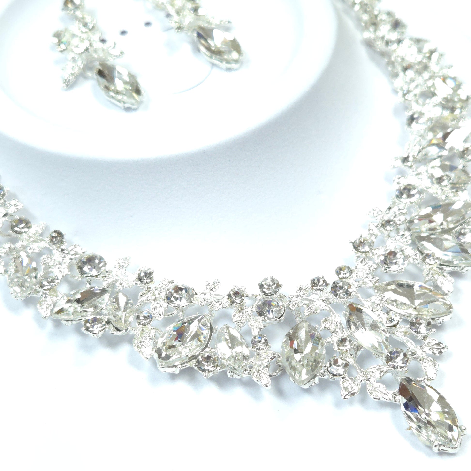 Close-up of a decorative ribbon with crystals on a white background