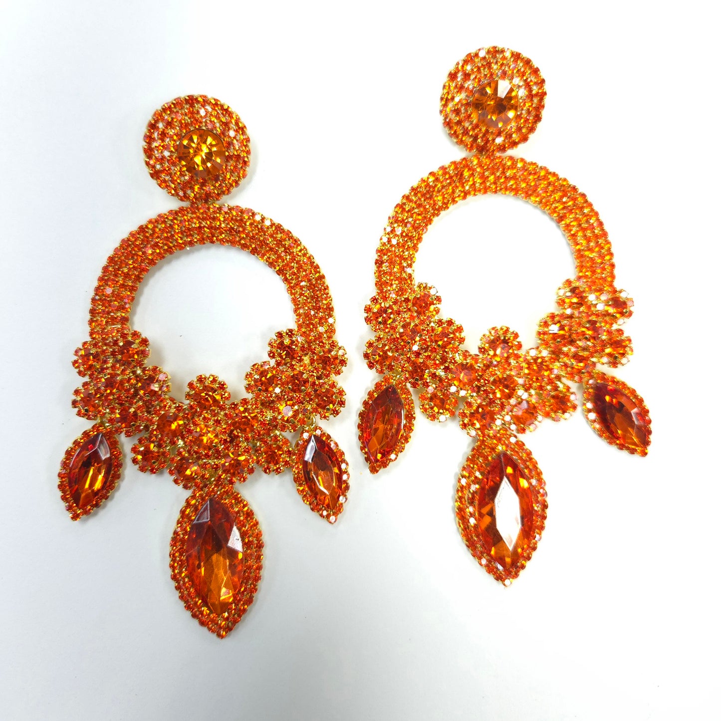Pair of orange beaded earrings on a white background