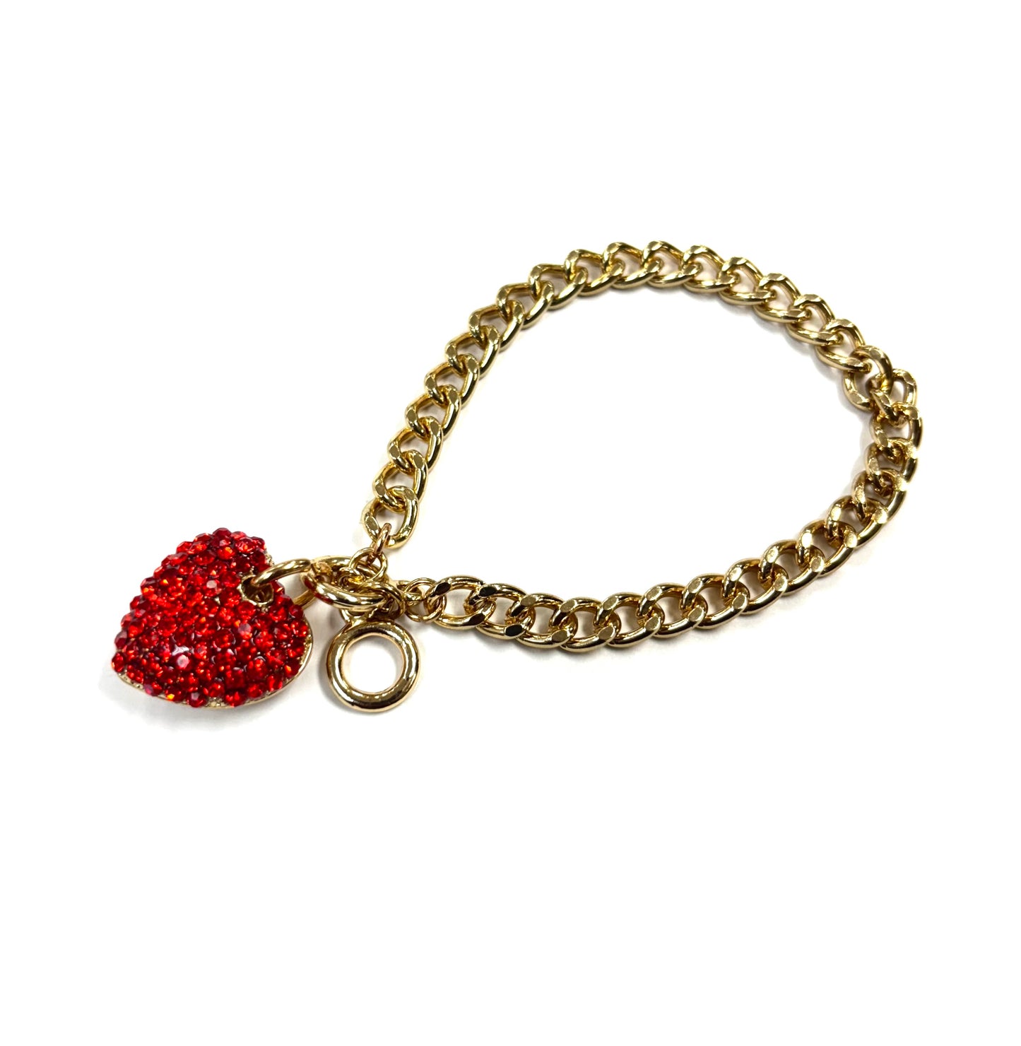 Gold chain bracelet with a red heart charm on a white background