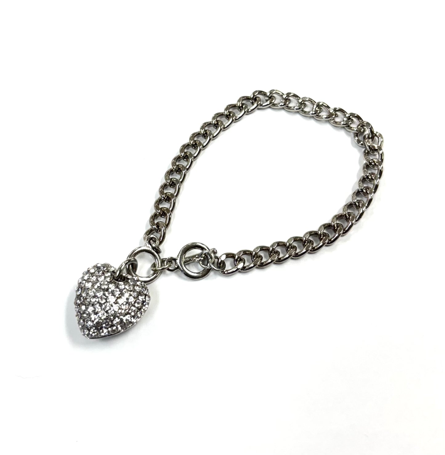 Silver chain bracelet with a heart-shaped charm on a white background