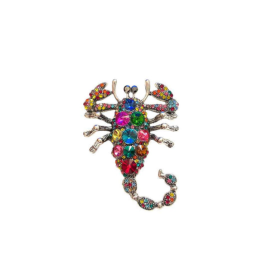 Multicolor crystal scorpion brooch with rhinestone detailing and curved tail design