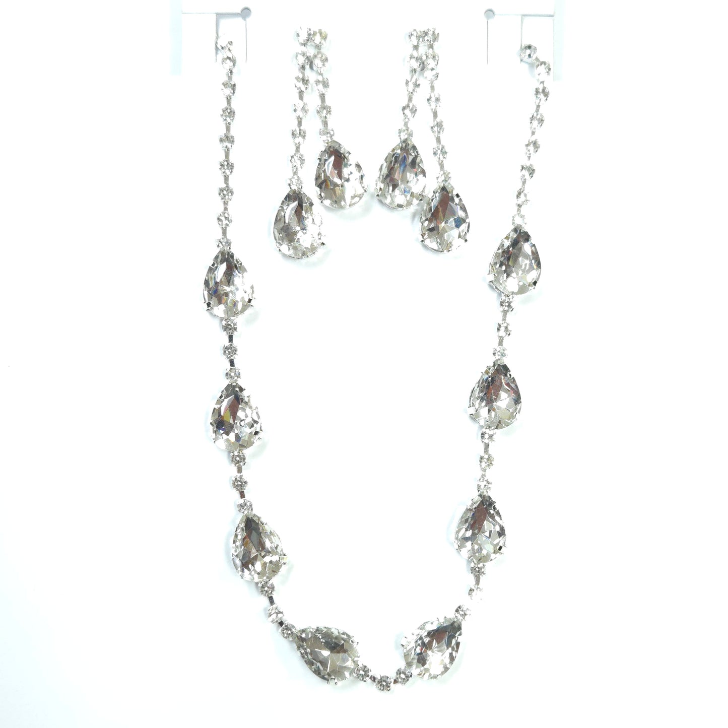 Silver chain necklace with clear gemstones on a white background