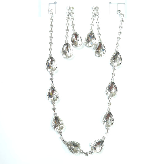 Silver chain necklace with clear gemstones on a white background