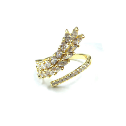 Gold ring with diamond accents on a white background