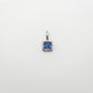 Silver pendant with a blue gemstone on a white background