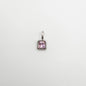Silver pendant with a pink gemstone on a white background