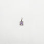 Silver pendant with a purple gemstone on a white background