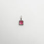 Silver pendant with a pink gemstone on a white background