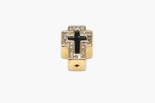 Gold and black cross pendant on a white background