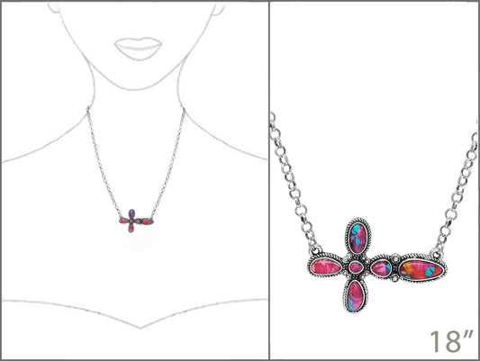 Colorful cross-shaped necklace on a white background with a measurement label.