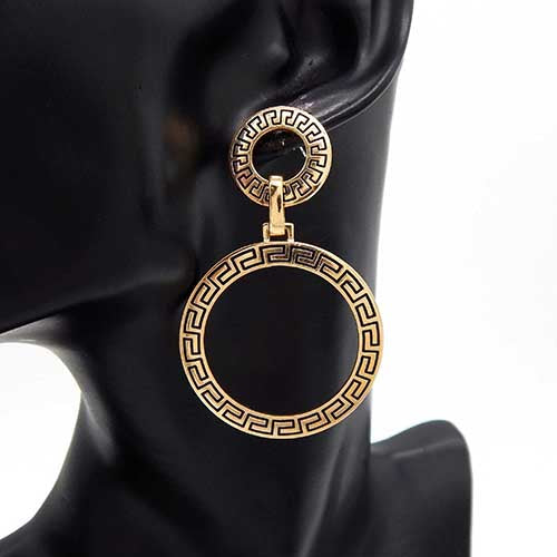 Double circle drop earrings with linked open ring design worn on mannequin ear with polished finish