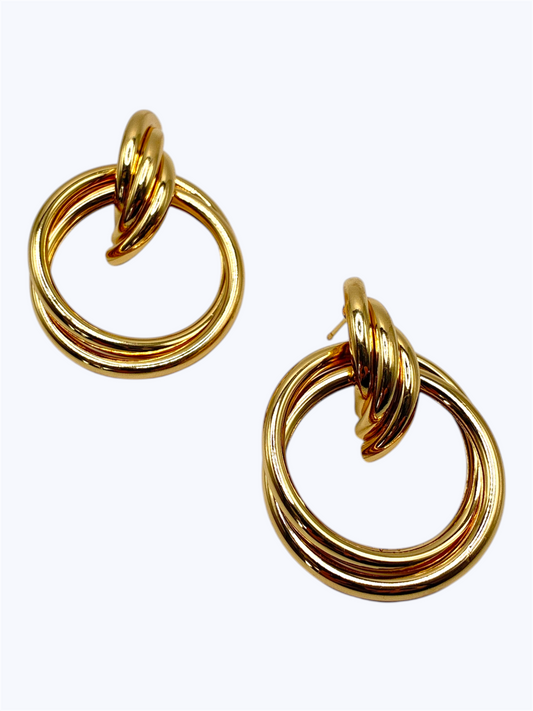 Elegant gold knot hoop earrings with a polished triple-ring circular design and modern statement style