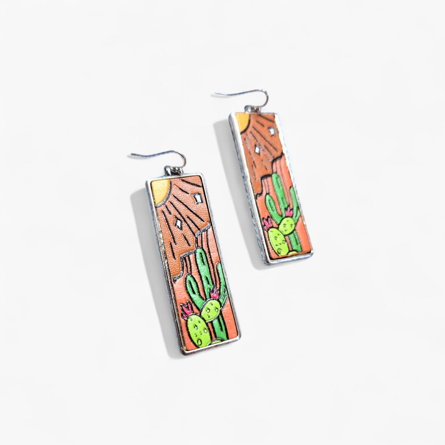 Rectangular earrings with cactus design on a white background