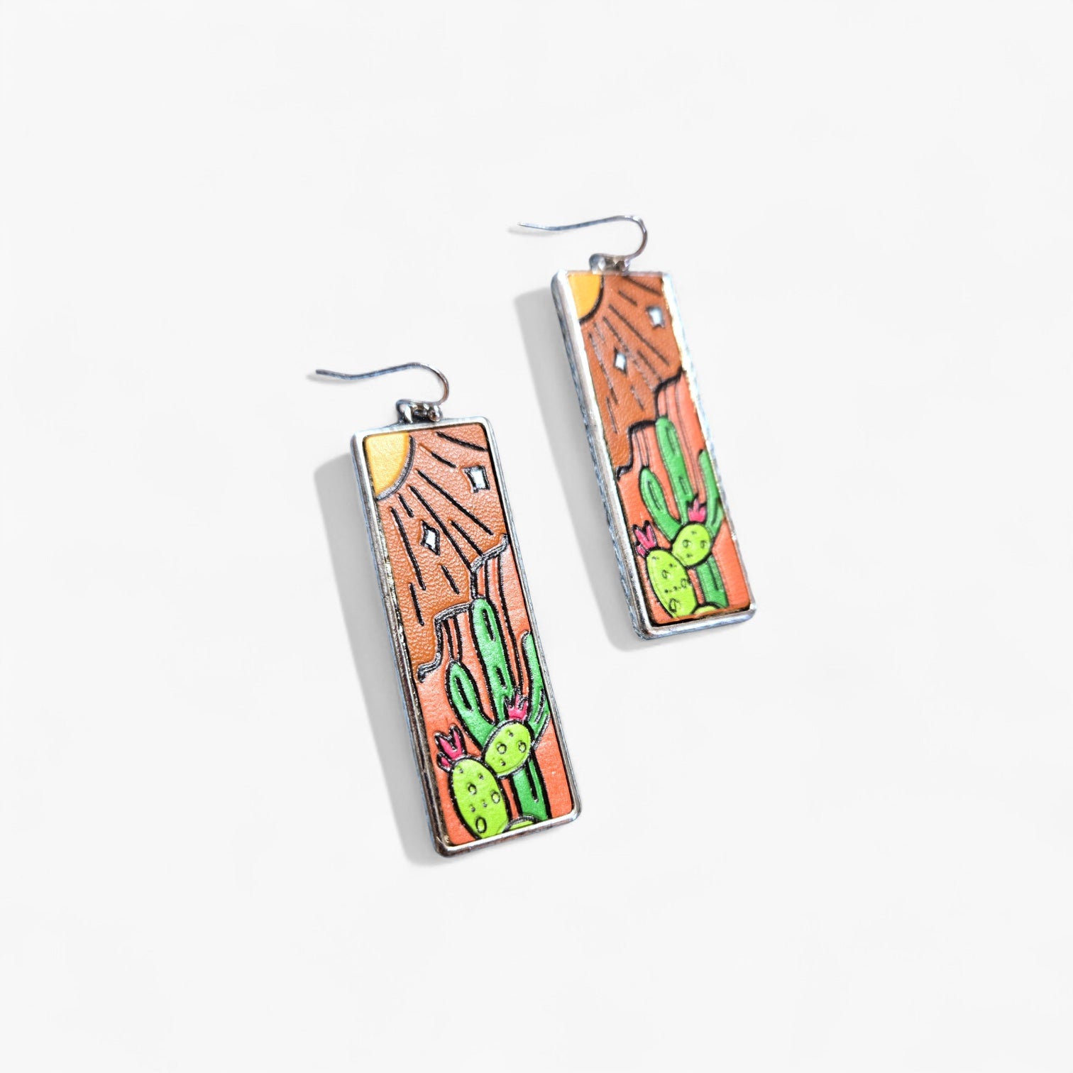 Rectangular earrings with cactus design on a white background