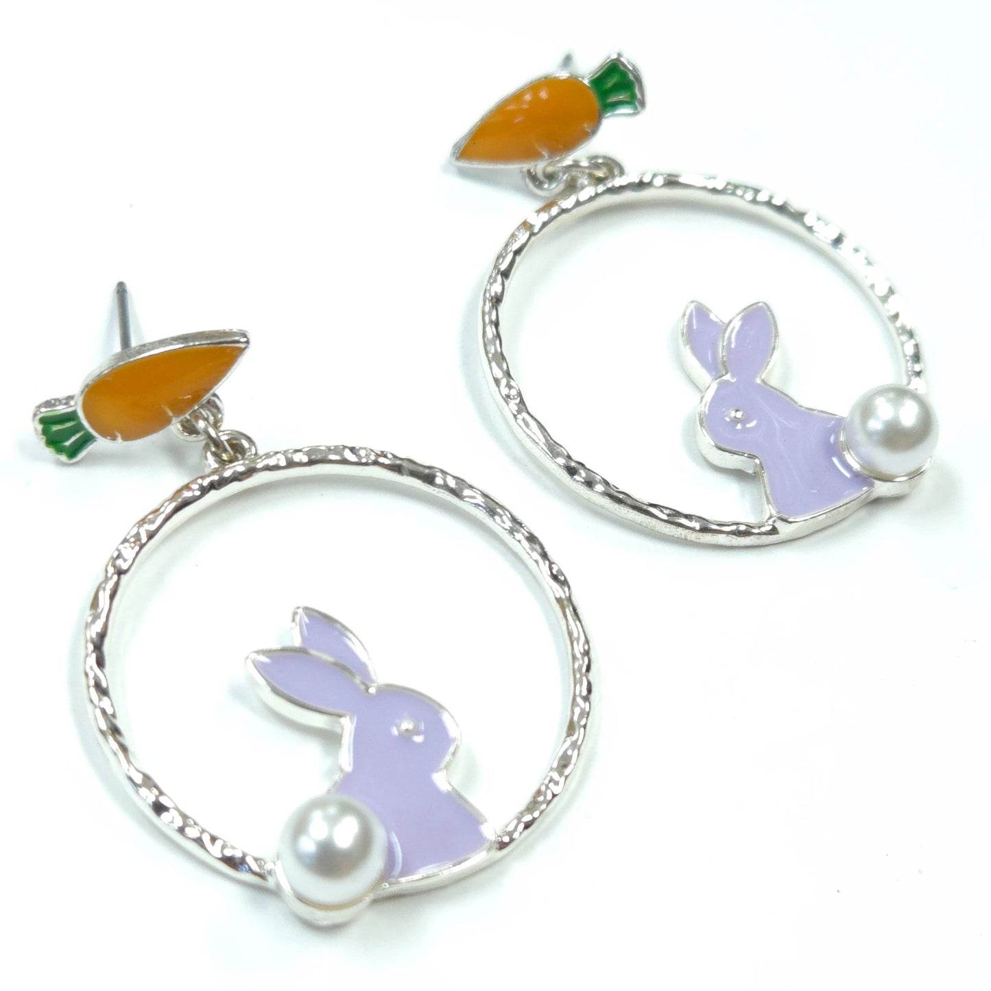 Earrings with bunny and carrot designs on a white background