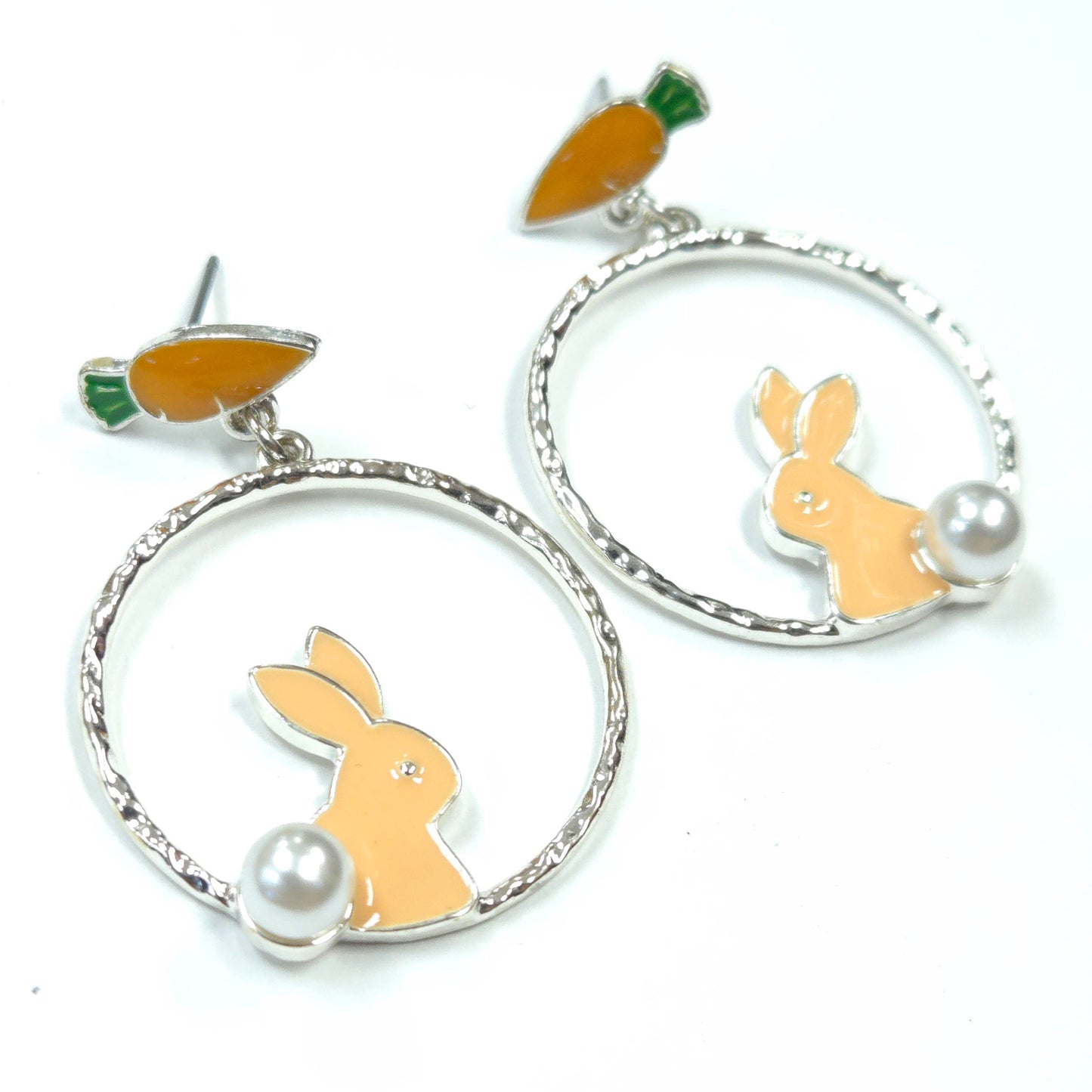 Earrings with rabbit and carrot designs on a white background