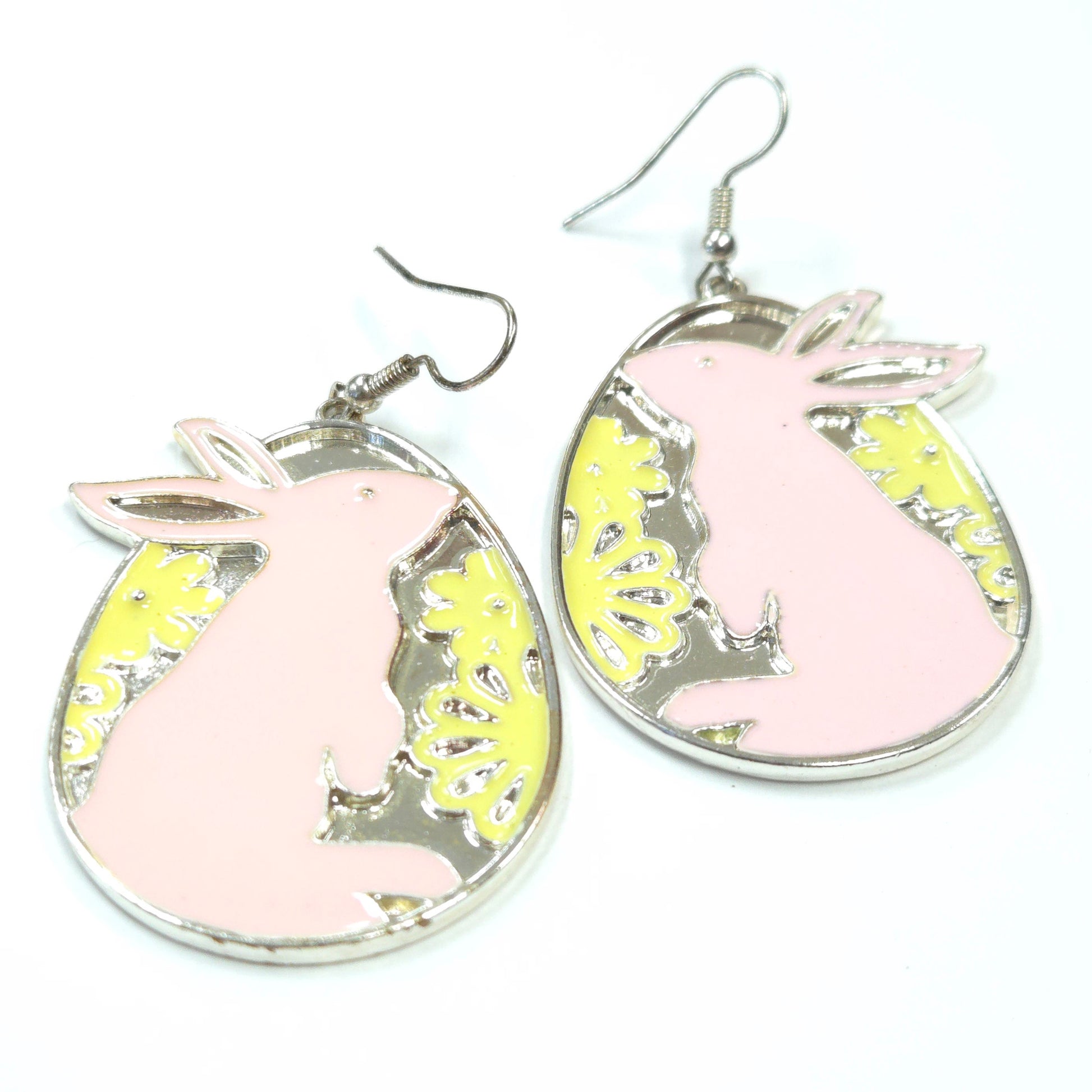 Earrings with pink and yellow designs on a white background