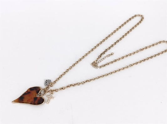 Gold necklace with a tortoiseshell heart pendant on a white background