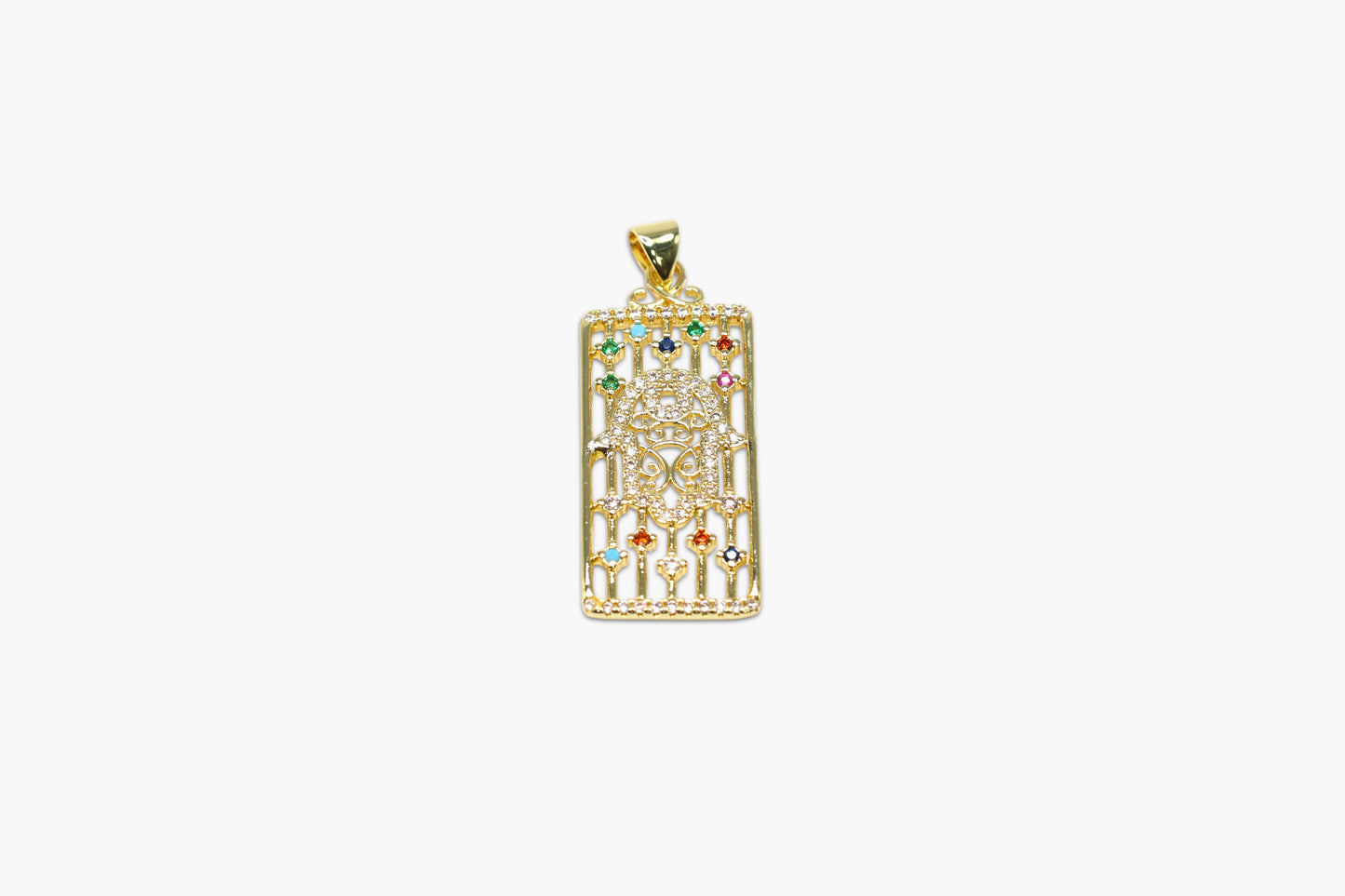 Gold pendant with colorful gemstones on a white background