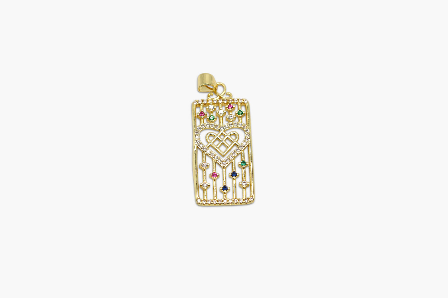 Gold pendant with heart design and colorful stones on a white background