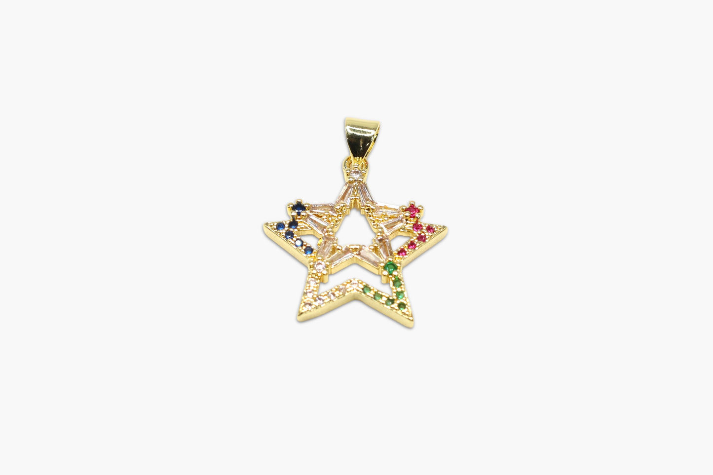 Gold star-shaped pendant with embedded gemstones on a white background