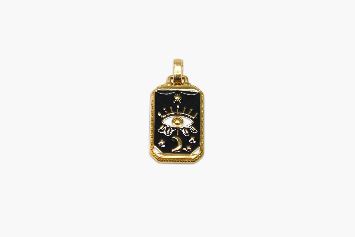 Gold pendant with black and white design on a white background