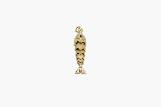Gold fish-shaped pendant on a white background