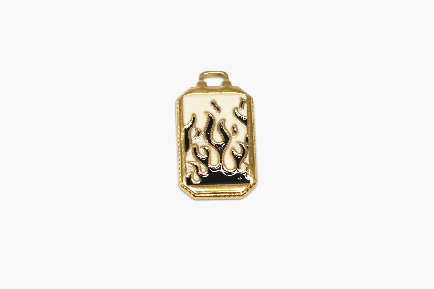 Gold pendant with flame design on a white background