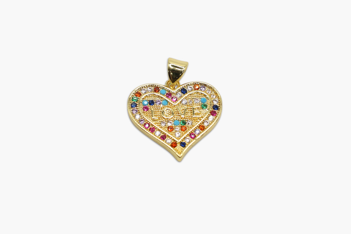 Heart-shaped gold pendant with colorful gemstones on a white background