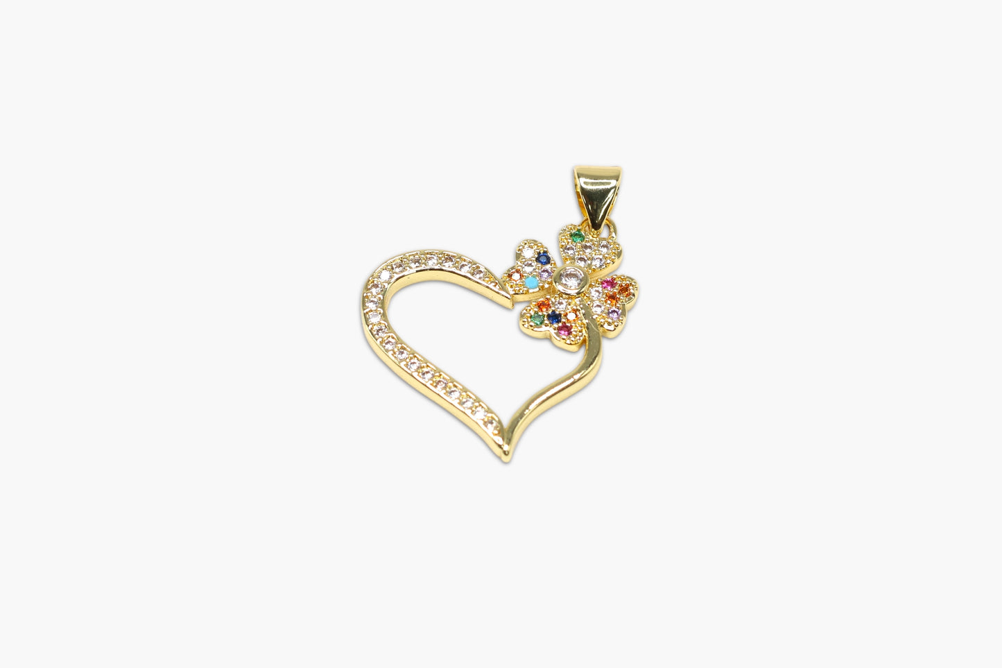 Gold heart-shaped pendant with colorful stones on a white background
