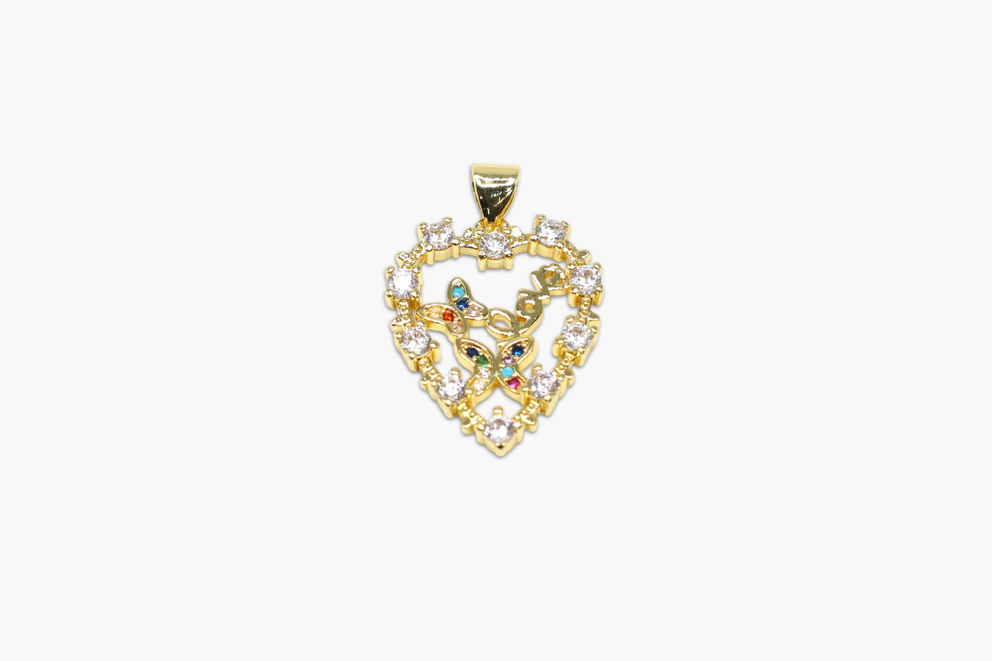 Gold pendant with intricate design and colorful stones on a white background