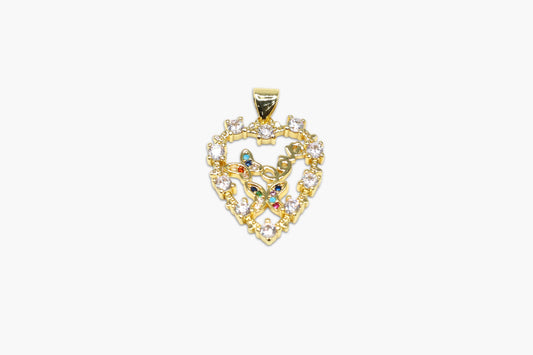 Gold pendant with intricate design and colorful stones on a white background