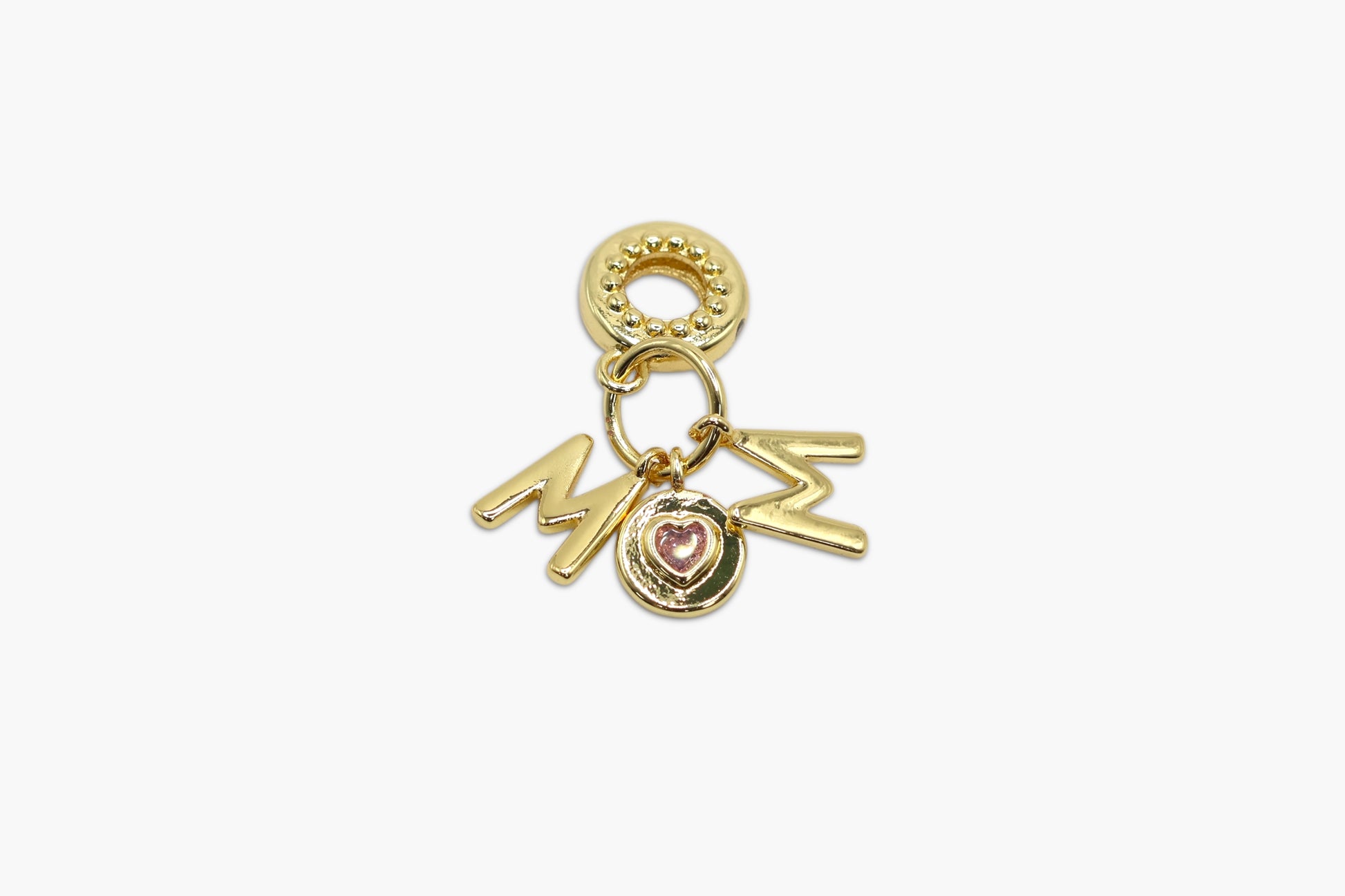 Gold charm with 'MOM' and heart details on a white background