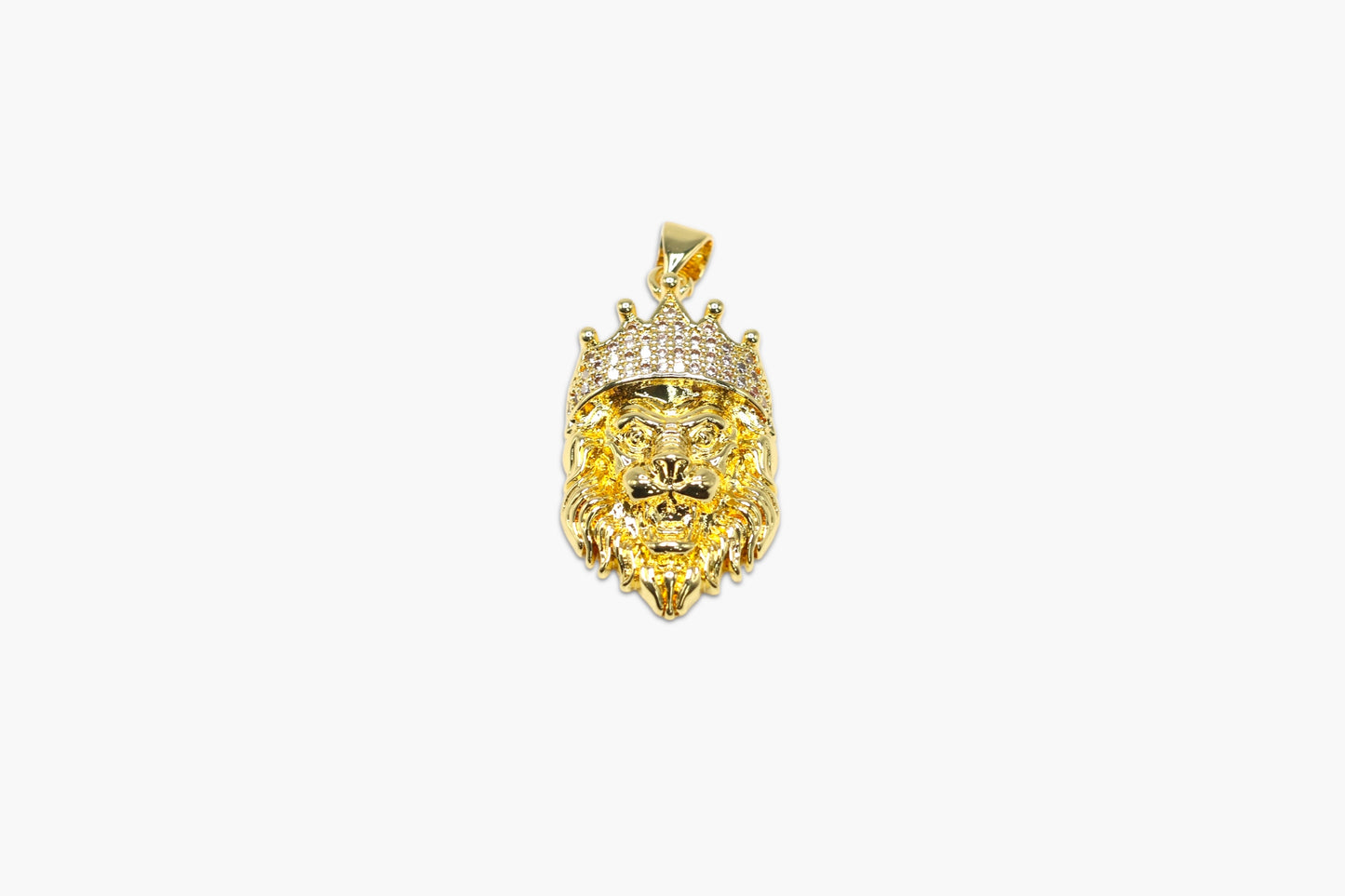 Gold lion head pendant with a crown on a white background