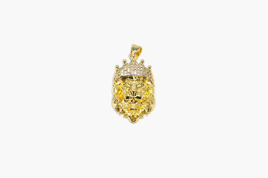 Gold lion head pendant with a crown on a white background