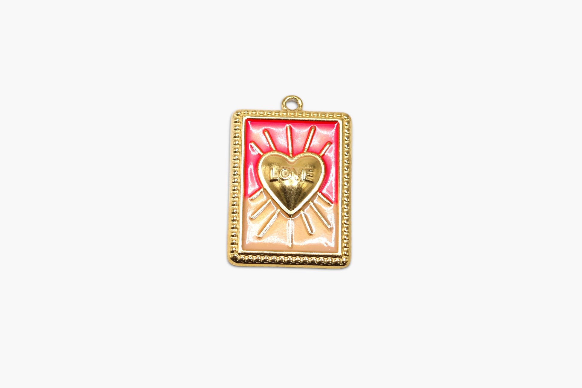 Gold-framed pendant with a heart design on a white background
