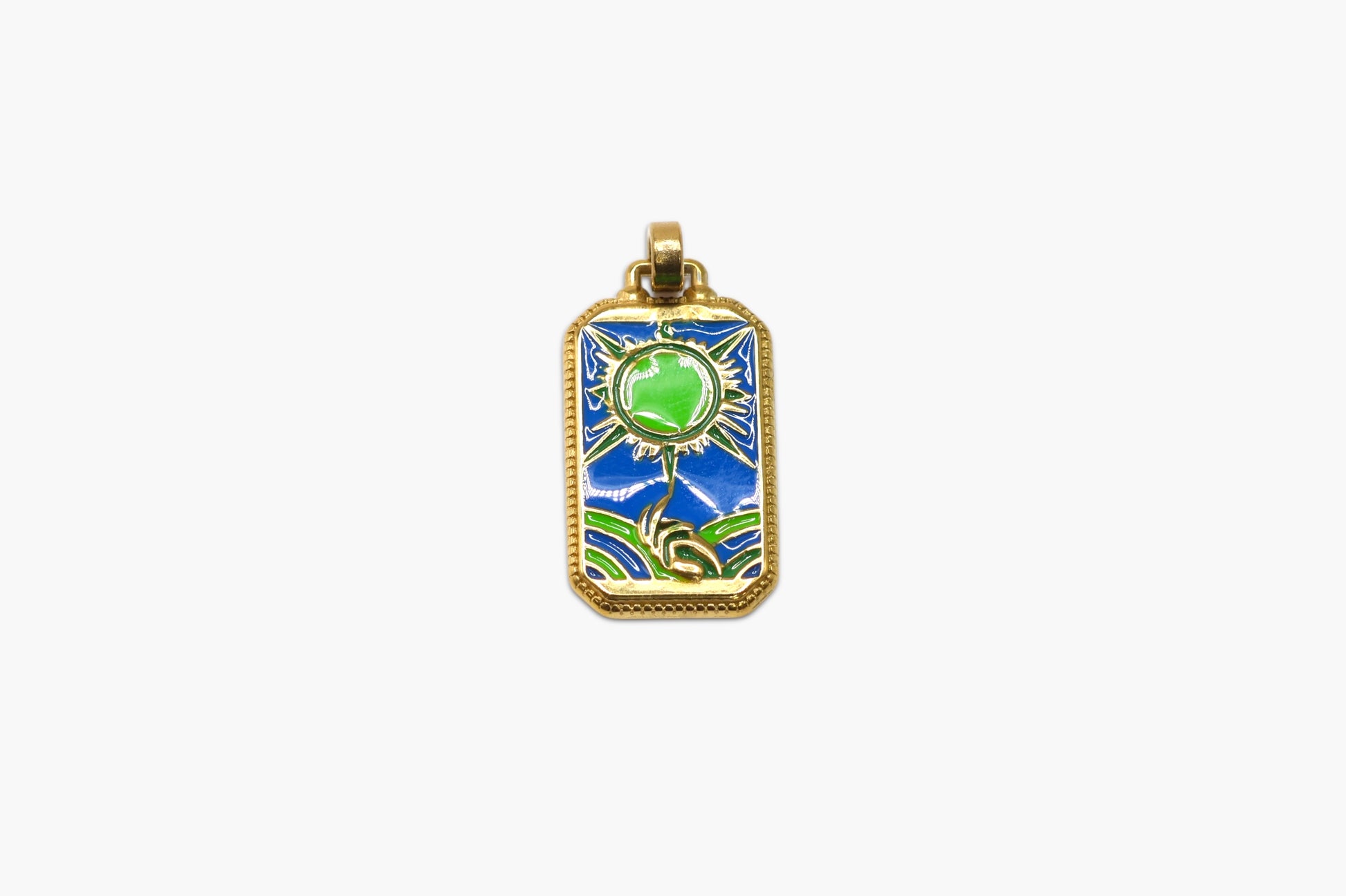 Gold pendant with green gemstone and blue background on a white background