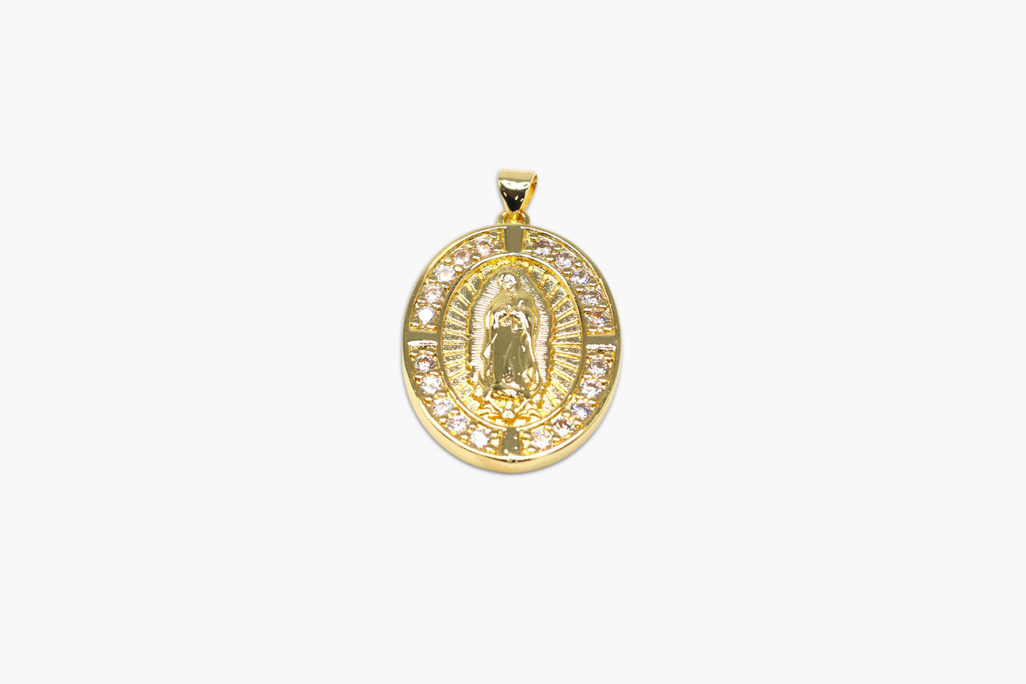 Gold pendant with a religious figure design on a white background