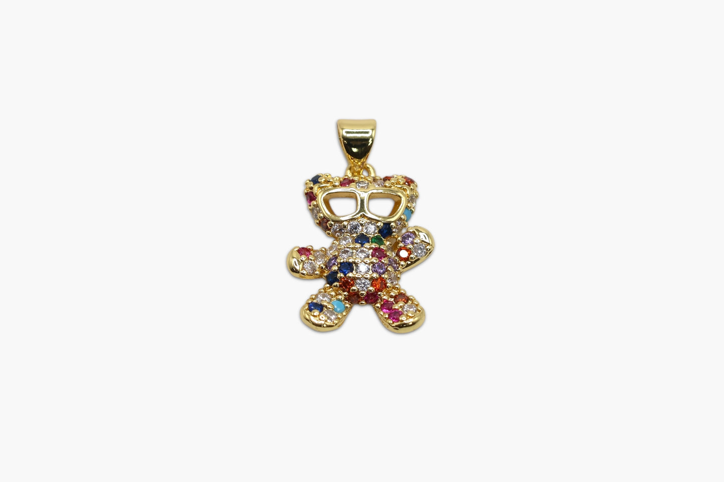 Colorful teddy bear pendant with gemstones on a white background